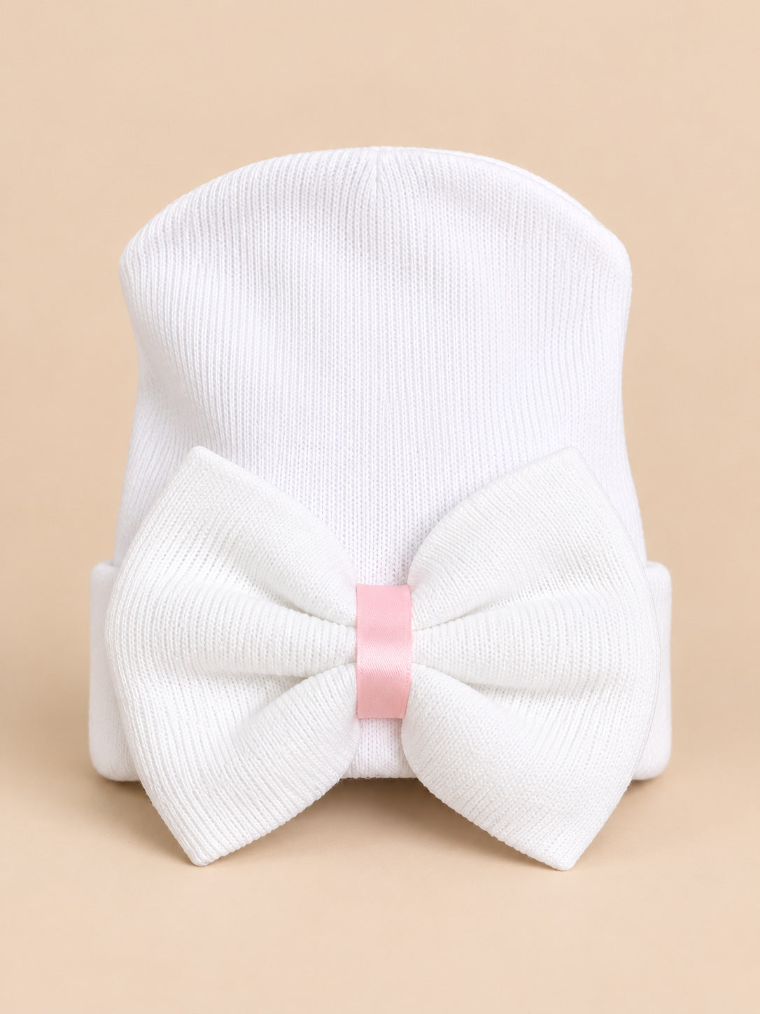 Cappellino da neonata in cotone a righe con grande fiocco, colori bianco e rosa, vista frontale