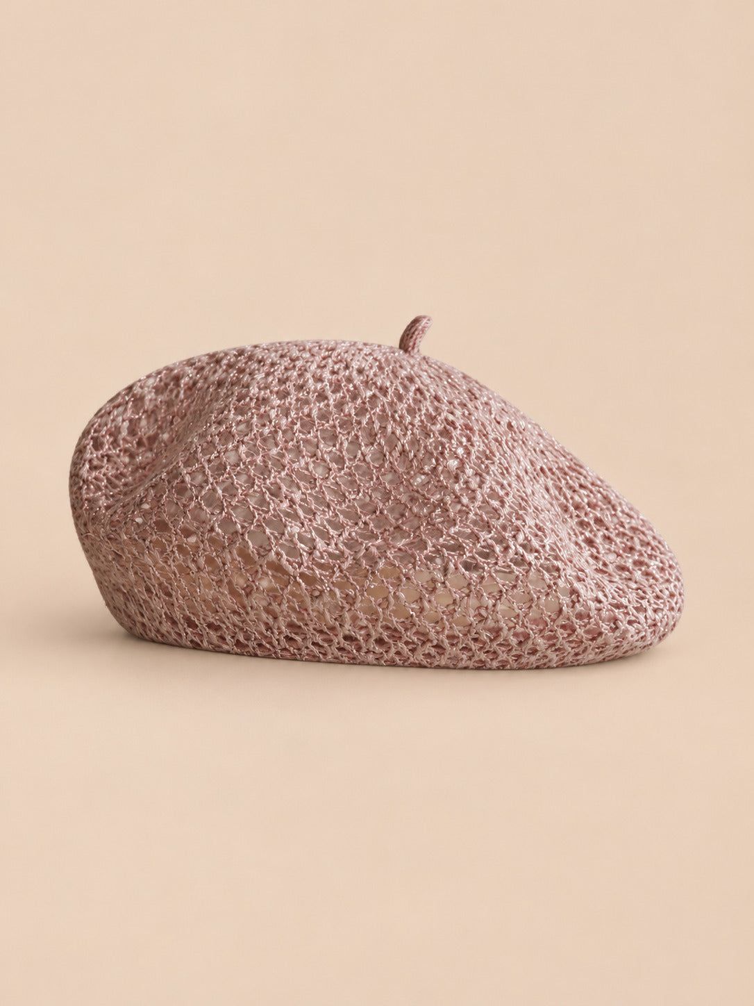 Basco da donna a forma di zucca, traforato in filato brillante, colore rosa, vista frontale