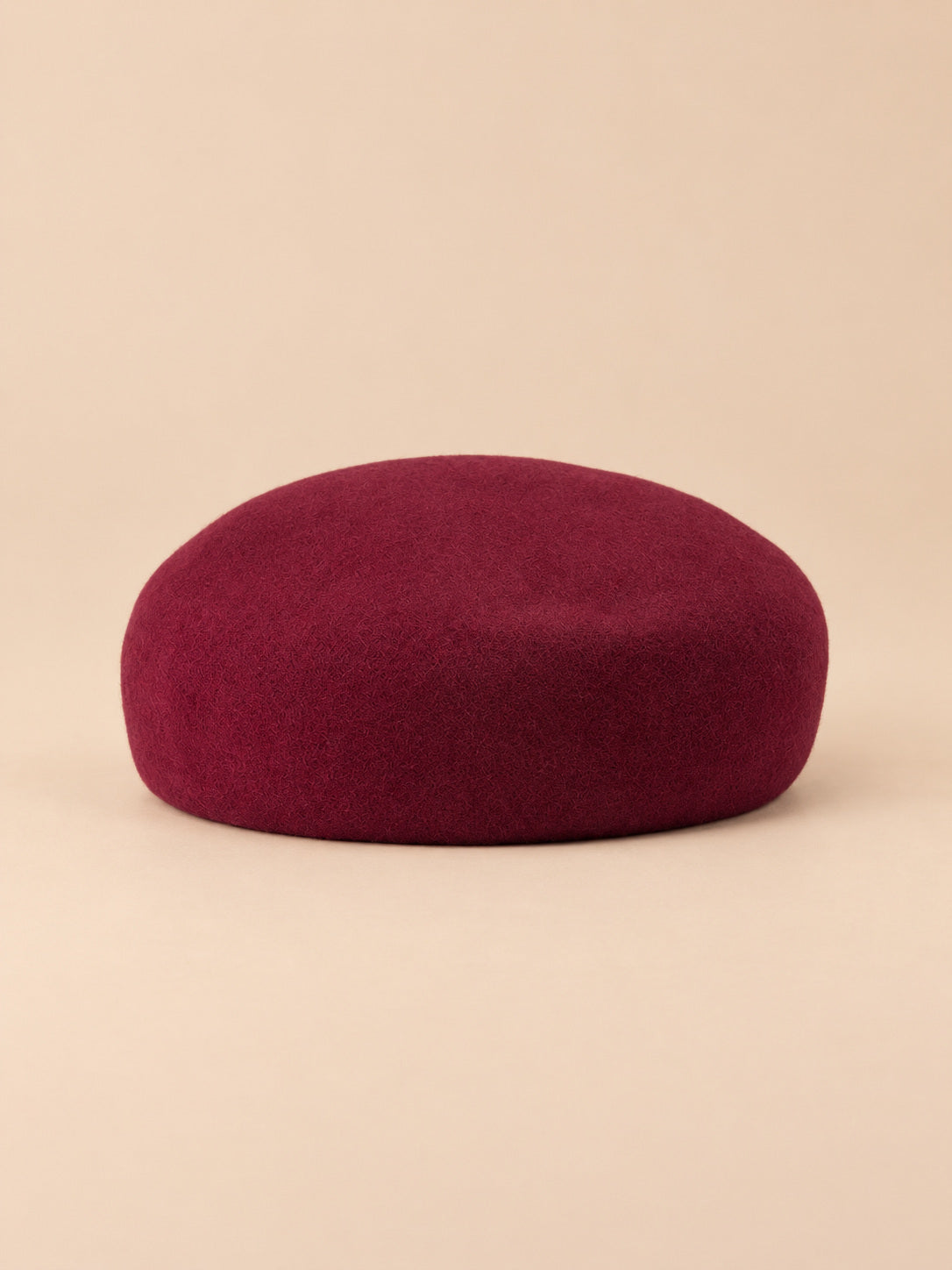 Basco elegante da donna in lana infeltrita da cerimonia, colore bordeaux, forma rotonda, vista frontale