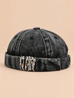Berretto docker Bocca in denim patchwork leopardato, colore nero, vista di tre quarti