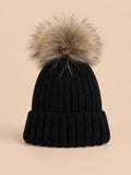 Set berretto e sciarpa da bambino con pompon in pelliccia, colore nero, vista frontale