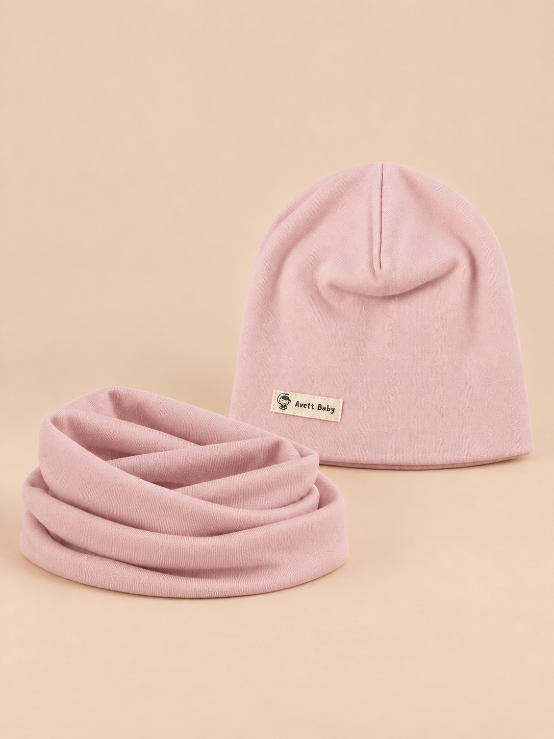 Set berretto e sciarpa da bambino a tinta unita, variante rosa, vista frontale nella foto del prodotto