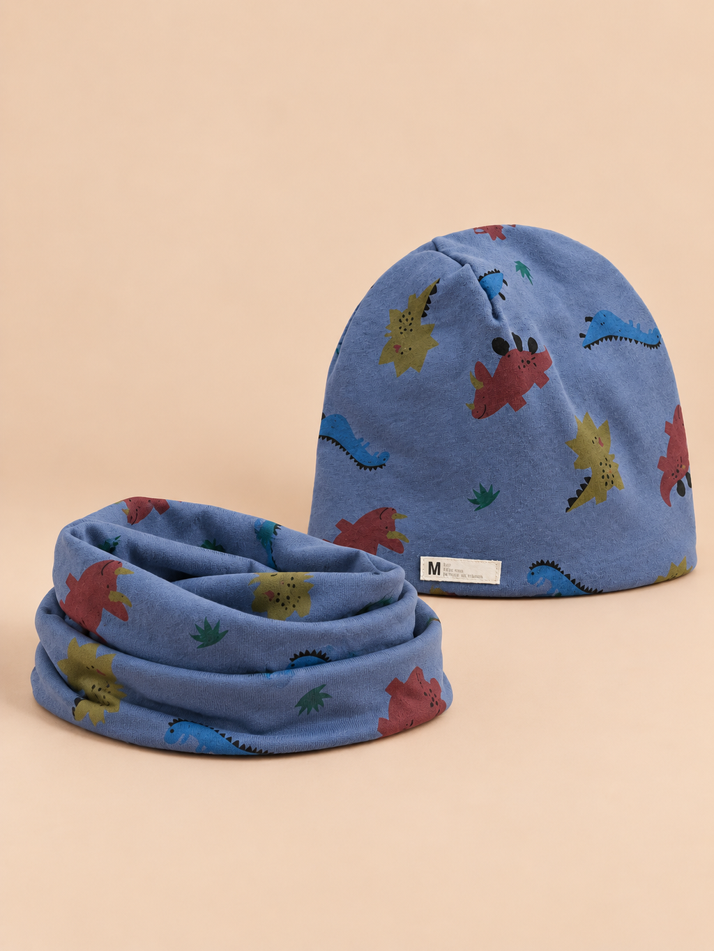 Set berretto e sciarpa da bambino con dinosauri, variante dinosauro blu, vista frontale