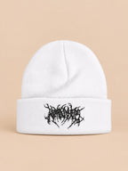 Berretto in maglia caldo e versatile per l’inverno, colori bianco e nero, vista frontale