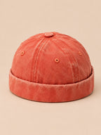 Berretto docker da marinaio in denim di cotone scolorito, colore arancione, vista di tre quarti