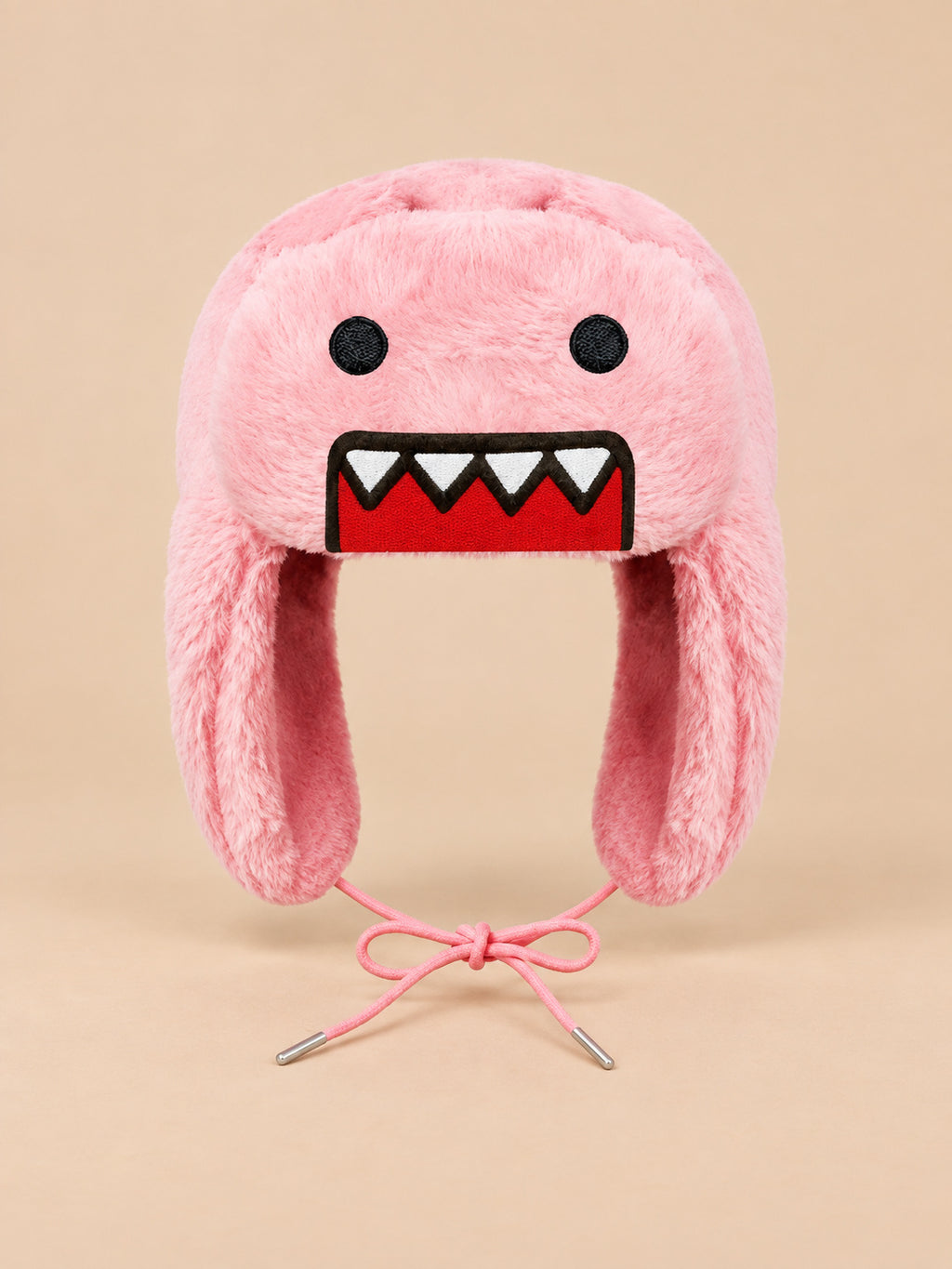 Berretto rosa con motivo cartoon, paraorecchie laterali e superficie effetto peluche, visto di fronte