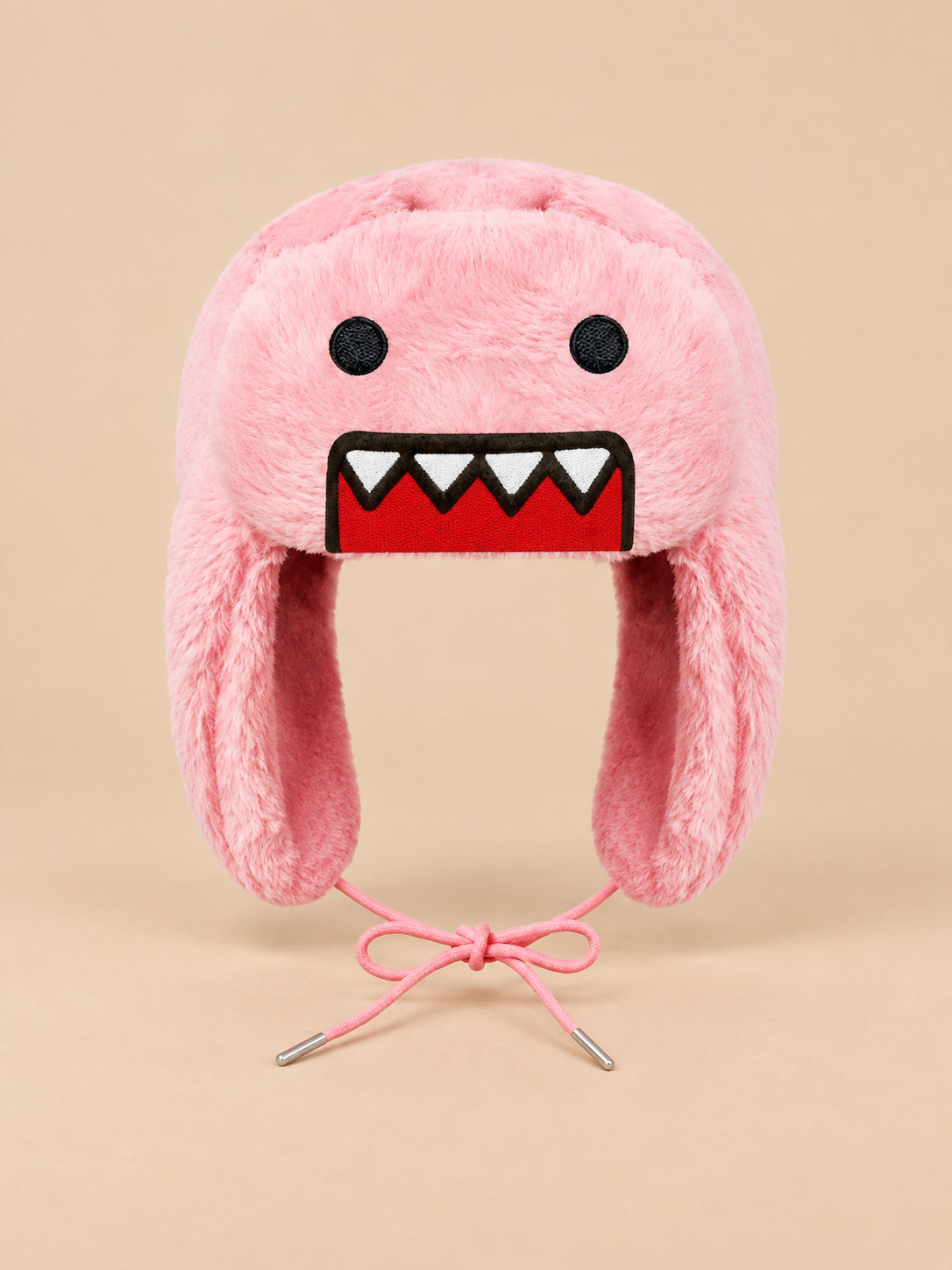 Berretto rosa con motivo cartoon, paraorecchie laterali e superficie effetto peluche, visto di fronte