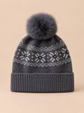 Berretto in cashmere con pompon e paraorecchie, colore grigio scuro, vista frontale