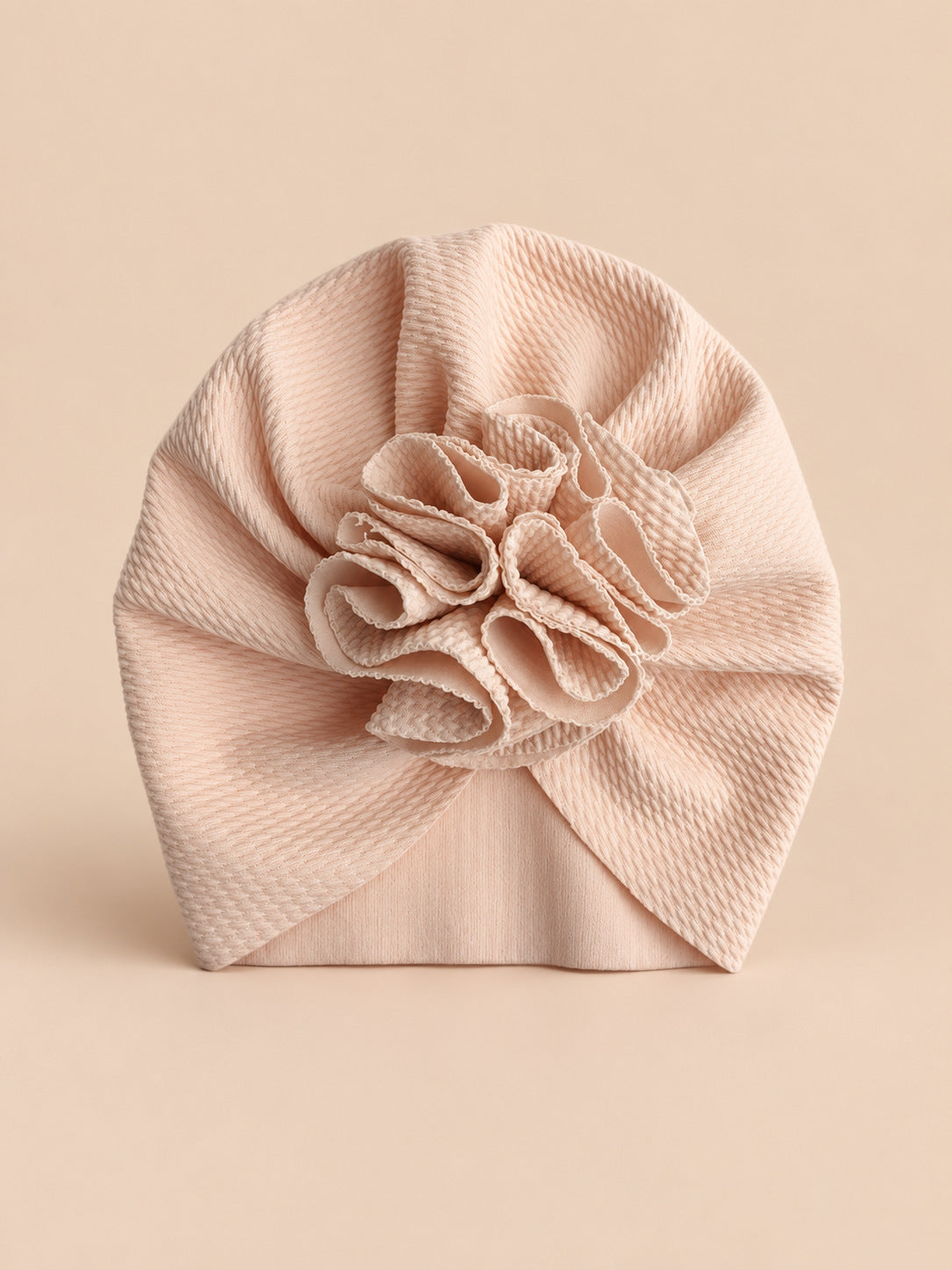 Turbante da neonata con fiore, dalla nascita, colore beige, vista frontale nella foto del prodotto