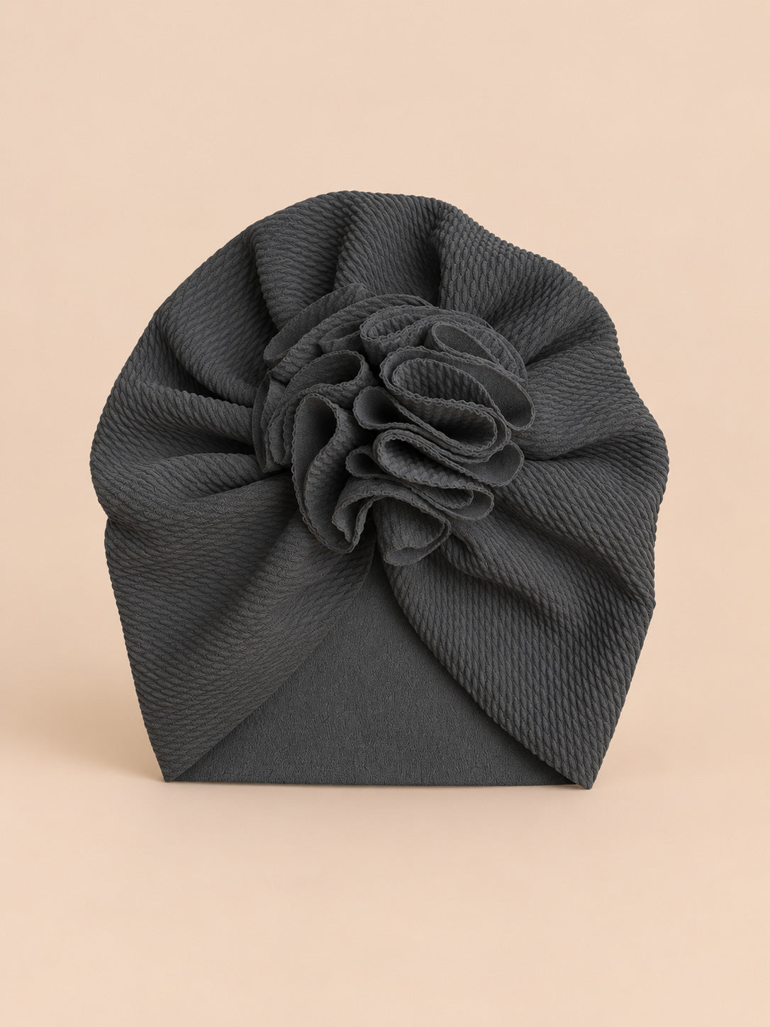 Turbante da neonata con fiore, dalla nascita, colore nero, vista frontale nella foto del prodotto