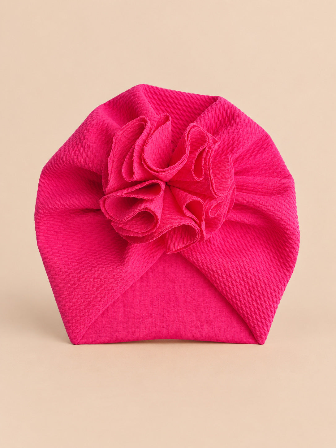 Turbante da neonata con fiore, dalla nascita, colore fucsia, vista frontale nella foto del prodotto