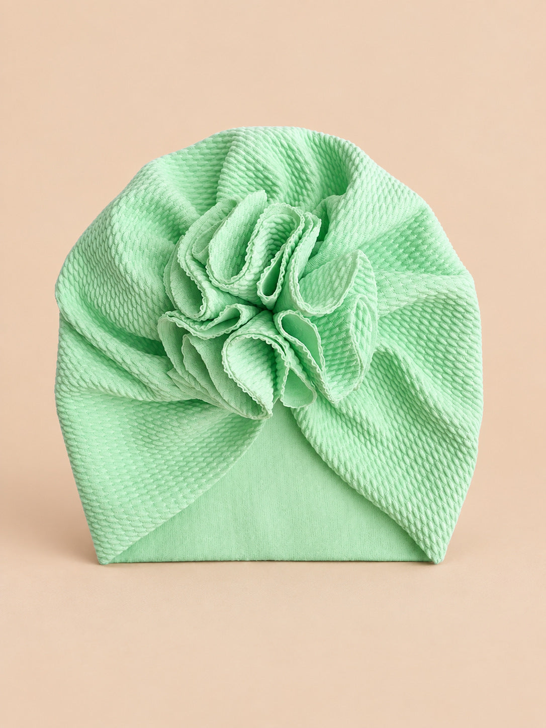 Turbante da neonata con fiore, dalla nascita, colore verde, vista frontale nella foto del prodotto
