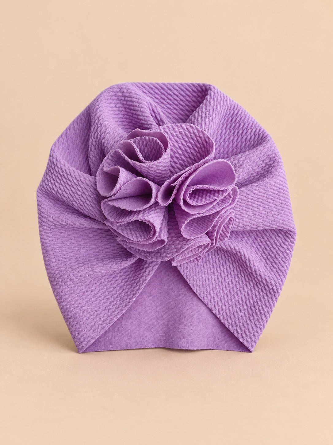 Turbante da neonata con fiore, dalla nascita, colore viola, vista frontale nella foto del prodotto