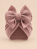 Turbante annodato da neonata coordinato mamma e bambina, colore rosa antico, vista frontale