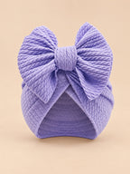 Turbante annodato da neonata coordinato mamma e bambina, colore viola, vista frontale