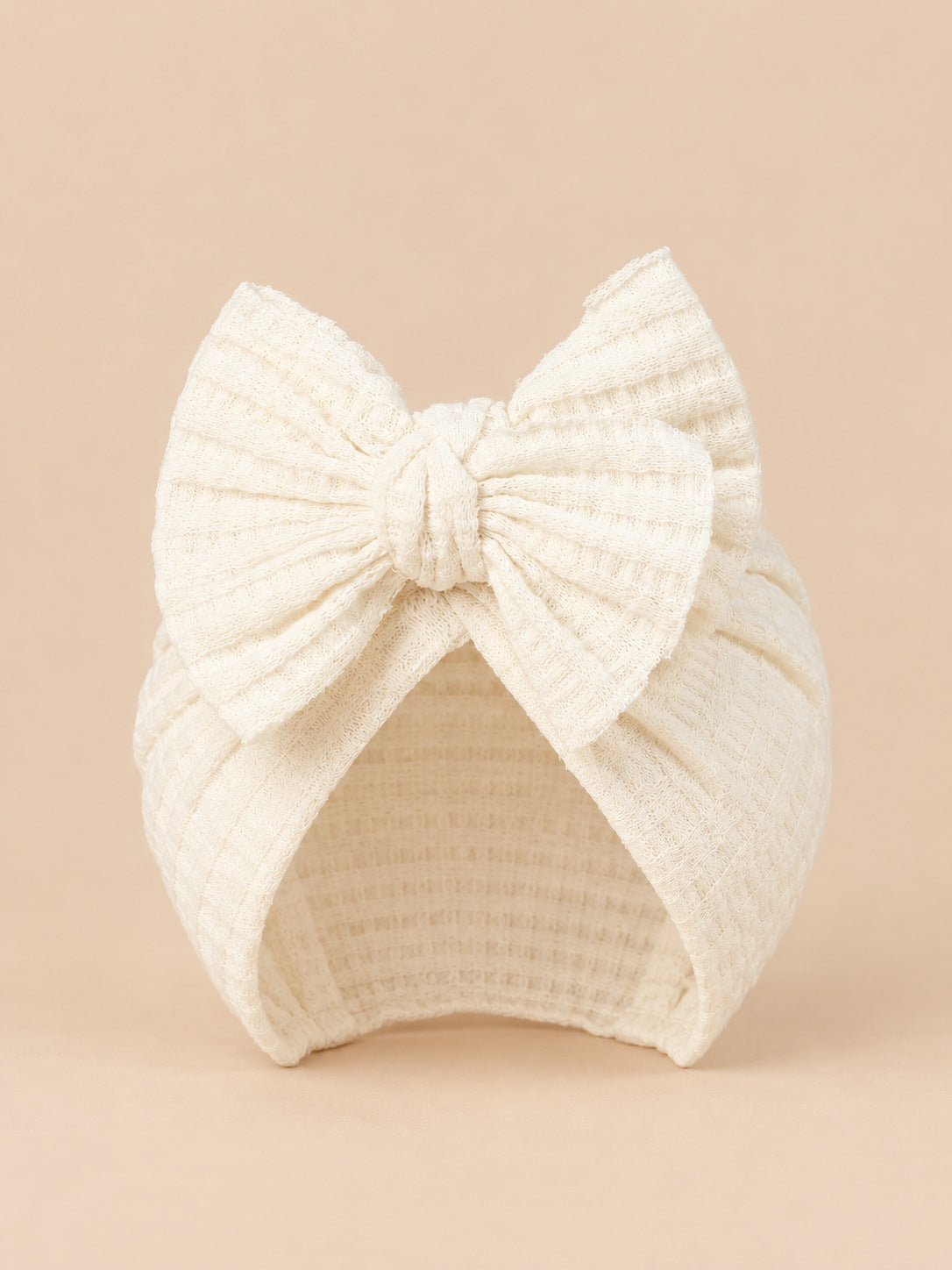 Turbante da neonata con fiocco in cotone lavorato a maglia, colore bianco naturale, vista frontale