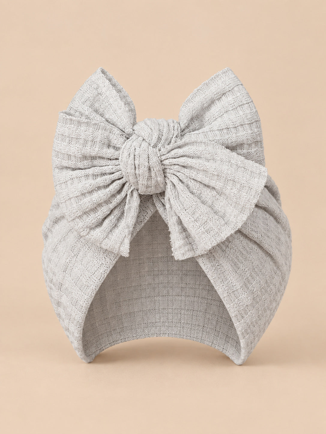 Turbante da neonata con fiocco in cotone lavorato a maglia, colore grigio chiaro, vista frontale